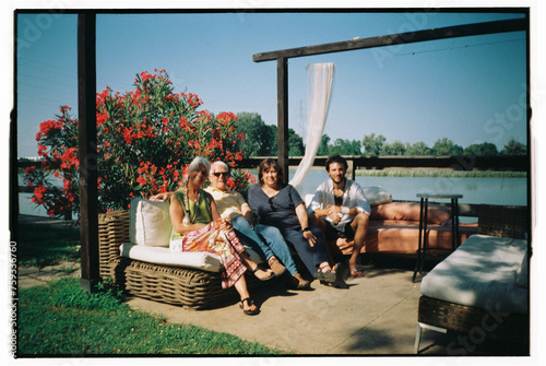 Summer family film portrait by the Italian lake photo