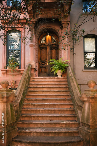 American brownstone house with a high stoop