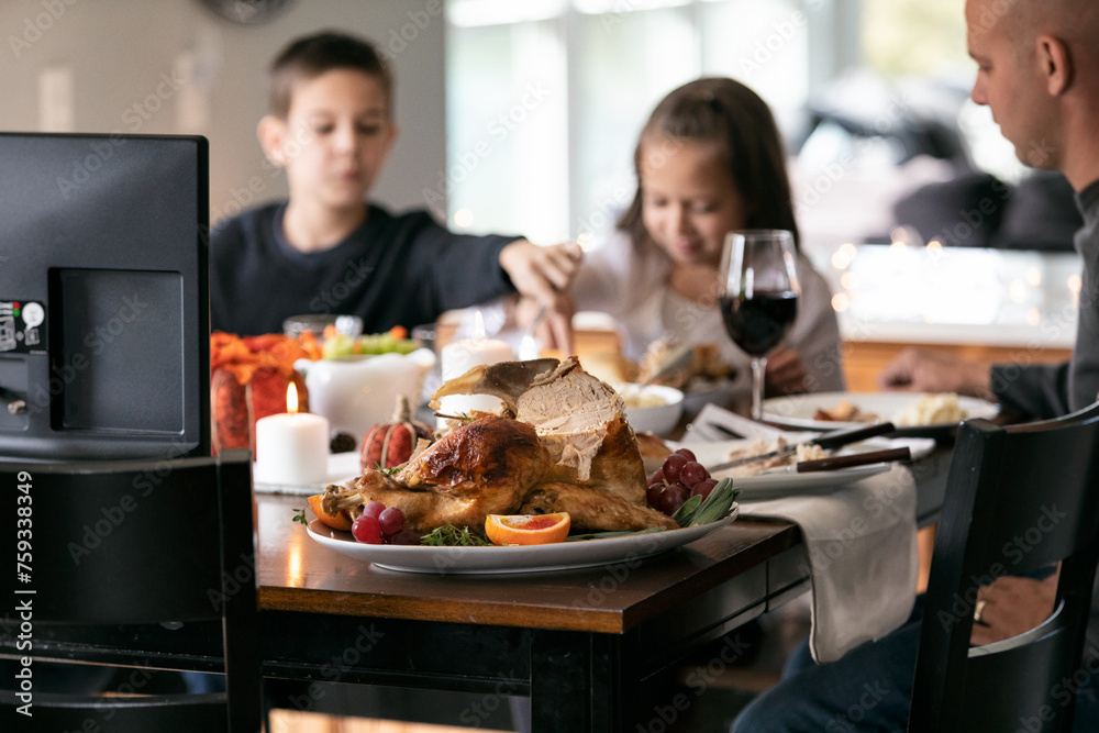 Thanksgiving: Carved Turkey On Platter With Family Eating Thanksgiving: Carved Turkey On Platter With Family Eating