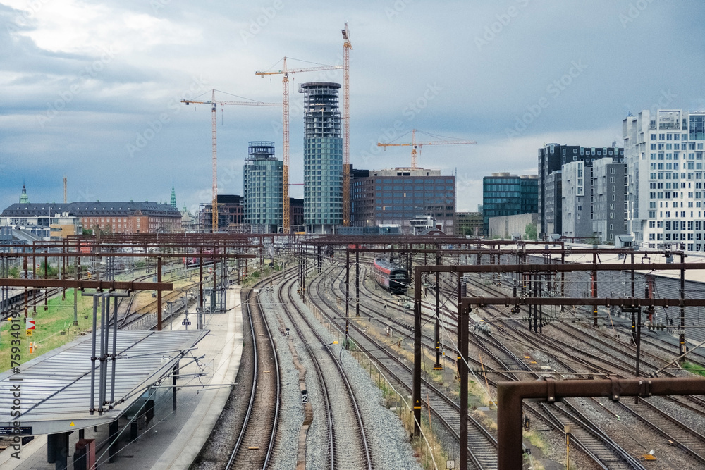 Cityscape of a train station with the city skyline on the background Cityscape of a train station with the city skyline on the background
