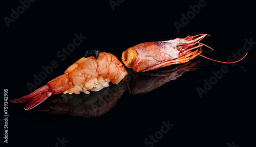 Delicious shrimp nigiri on black background photo