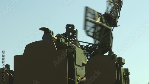 Tracking radar of the anti-aircraft combat vehicle missile system. Mobile Military Air Defense Radar. Army radar antenna spins in search of an aerial target.