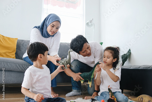 Kids Playing Toys Accompanied by Parents. Family Bonding on Weekend at Home. 