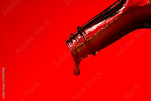 Hot Sauce on a Red Background
