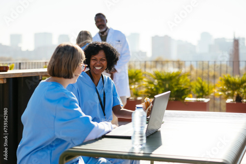 Medical team taking a break on hospital terrace photo