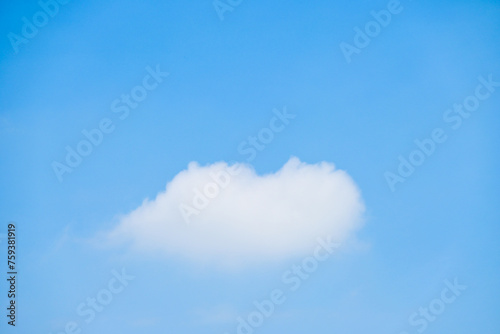 beautiful blue sky and white fluffy single cloud with sunrise in the morning  natural background
