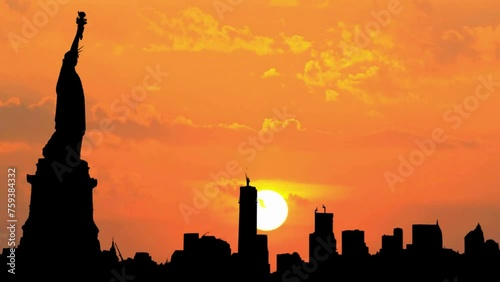 New York City (NYC) Skyline Silhouette Sunrise Time Lapse. Statue of Liberty