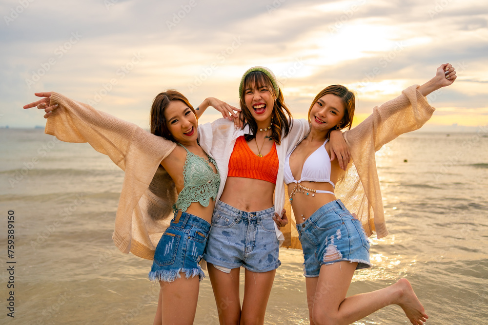 Portrait Group of Asian woman enjoy and fun outdoor lifestyle travel nature ocean on summer beach holiday vacation. Attractive girl friends walking and playing together at the sea on tropical island. Portrait Group of Asian woman enjoy and fun outdoor lifestyle travel nature ocean on summer beach holiday vacation. Attractive girl friends walking and playing together at the sea on tropical island.
