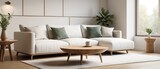 Scandinavian home interior design. Round wood coffee table against white sofa. 