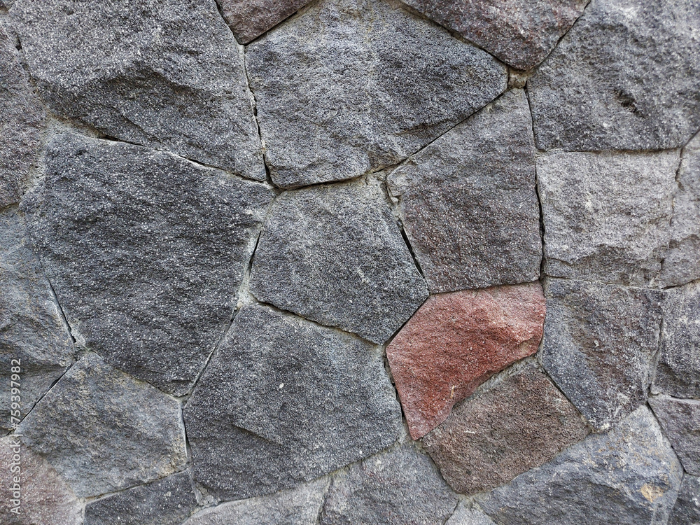 Fototapeta premium Photo of a natural stone home wall decoration with an isolated red pattern