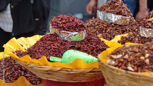Basket of chili grasshoppers for sale in the market in Oaxaca, Mexico photo