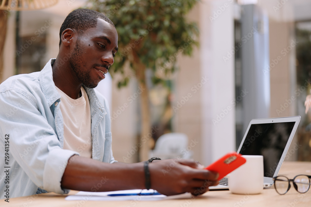 Naklejka premium Man adult african businessman computer technology sitting male person business laptop black working