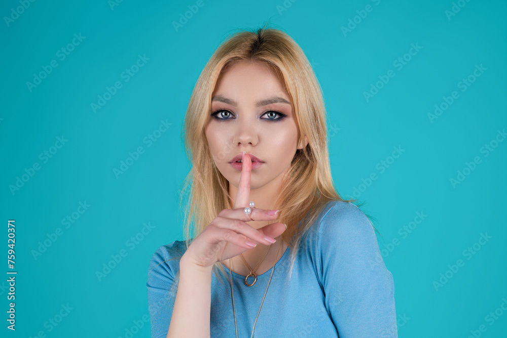 Silence gesture. Woman with finger on lips. The Shh. Portrait of sexy woman showing silence sign on isolated background. Shh girl. Hush shut silent Concept. Mute and quiet, finger on mouth shush sign. Silence gesture. Woman with finger on lips. The Shh. Portrait of sexy woman showing silence sign on isolated background. Shh girl. Hush shut silent Concept. Mute and quiet, finger on mouth shush sign.