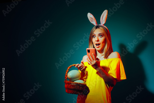 Funny Easter Woman Reading a Surprising SMS Text. Excited Girl receiving a chat message on paschal holidays 

