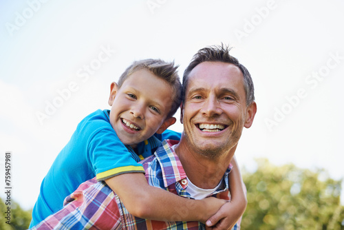 Piggyback, portrait and dad with kid to play outdoors for bonding, love and happiness in garden for fathers day. Parent, son and together with care for summer fun in backyard with shoulder game