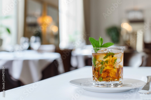 Refreshing Mint Julep Drink on Elegant White Table Setting Gen AI photo