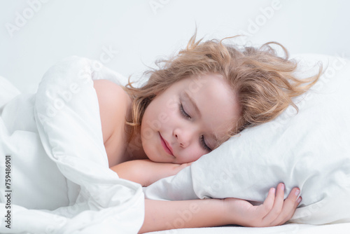 Bedding kid. Little boy sleeping in bed. Cute kid sleeping well alone in bed under blanket. Kid lying on comfort pillow, adorable small child rest asleep, enjoy good healthy sleep or nap.