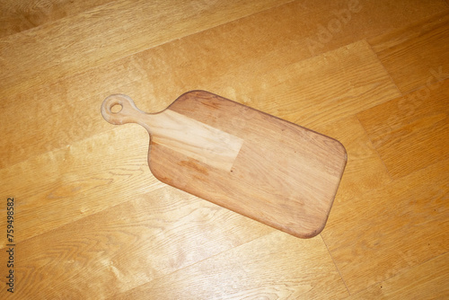 Wooden cutting board / chopping board with hard direct flashlight photo