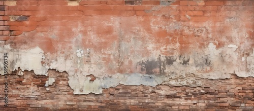 A close up of a brown brick wall with peeling paint, showcasing an intricate pattern of rectangular shapes. The natural landscape art of weathered wood flooring adds to the rustic charm