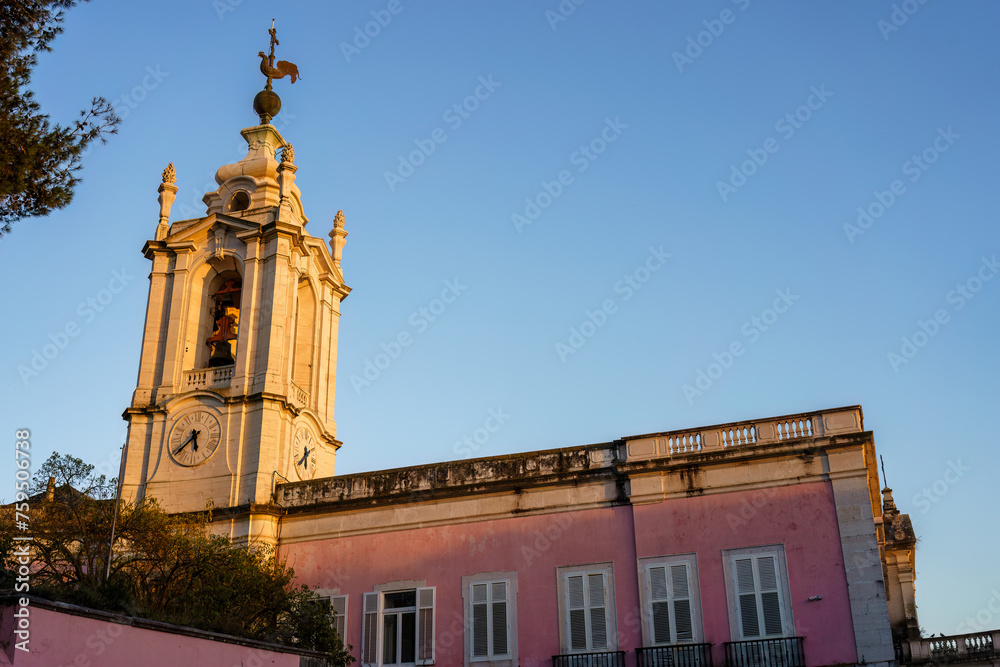 Bell tower of Capela de Nossa Senhora das Necessidades church in Lisbon, Portugal in the evening