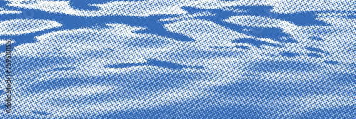 Vector drawing of waves on the sea. Vector halftone dots background, fading dot effect.	