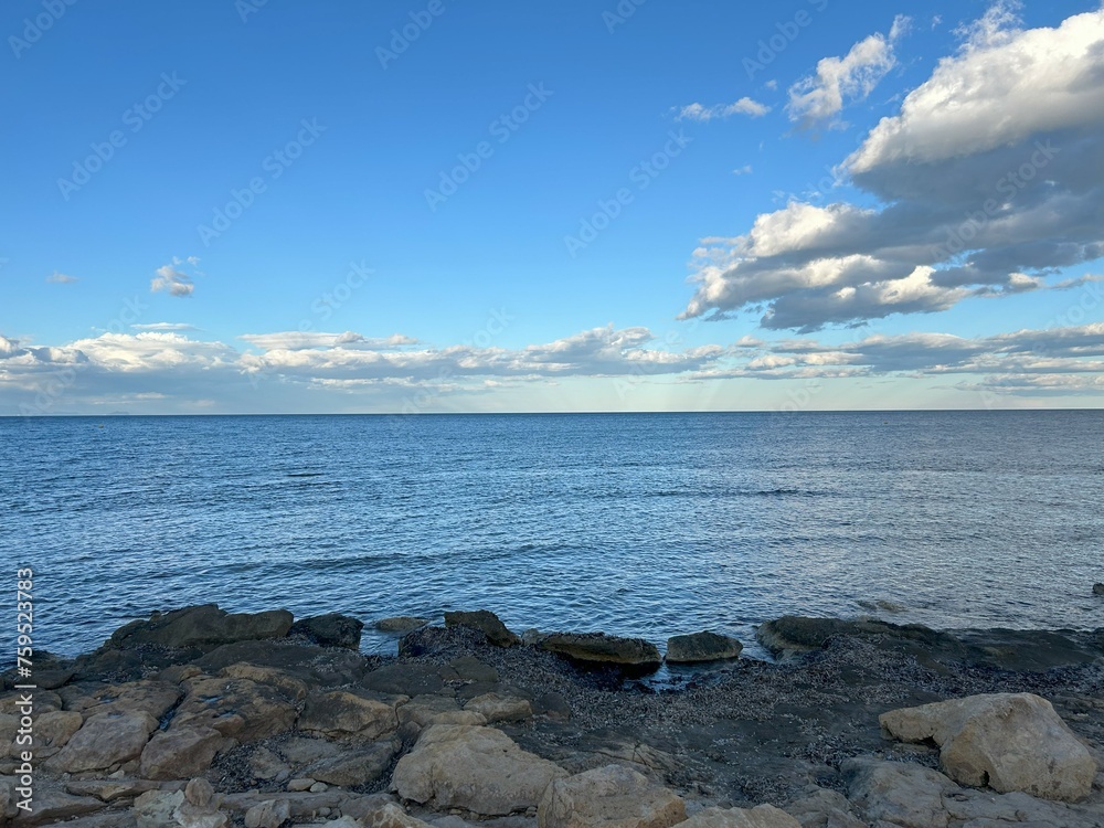 View of the Mediterranean Sea from the rocks on the beach.