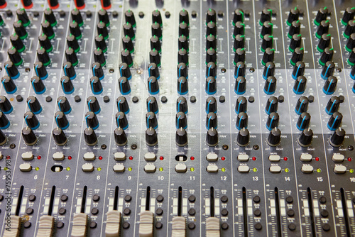 Volume and equalization controls on professional mixing console