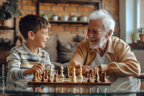 Old mature man, grandad playing chess with his grandson, family fun concept, people and lifestyle background