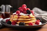 Delicious american pancakes with fresh berries and maple syrup, perfect dessert option for brunch