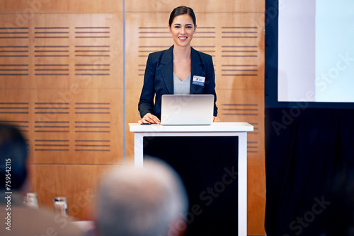 Fotografie Business woman, podium and presentation with smile, conference or workshop with laptop for slideshow or PPT