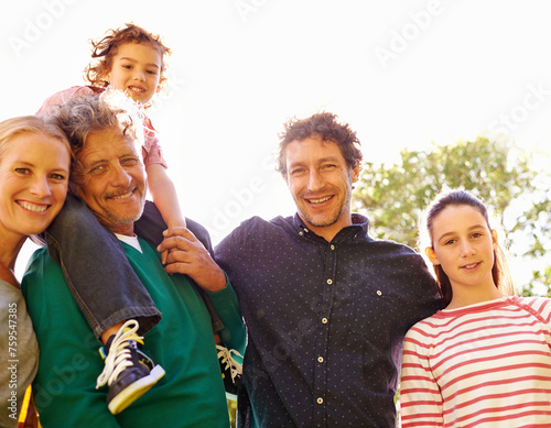 Family, portrait and smile in outdoor nature, love and bonding together or happy in backyard. Generations, relax and peace or care for support in garden or park, vacation and summer holiday in France