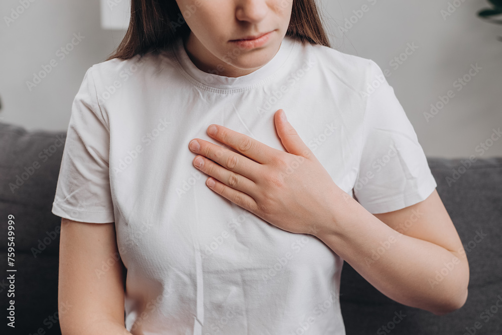 Worried young woman have symptom gastroesophageal, esophageal, stomach