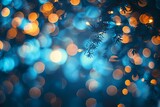 light blue bokeh with tree branches falling down, light flare shining background for holiday and celebrations 