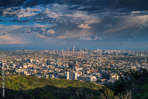 City of Los Angeles cityscape panorama after storm. Downtown LA skyline shot at sunset from Hollywood Hills.