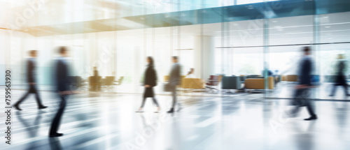 Business people walk in a large office lobby against a cityscape background. Motion blur effect, bright business workplace with people in walking in blurred motion in modern office space