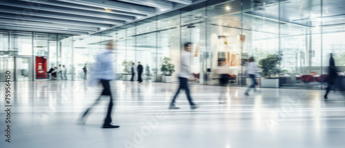 Business people walk in a large office lobby against a cityscape background. Motion blur effect, bright business workplace with people in walking in blurred motion in modern office space © ND STOCK