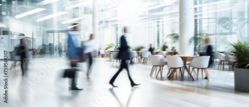 Business people walk in a large office lobby against a cityscape background. Motion blur effect, bright business workplace with people in walking in blurred motion in modern office space photo