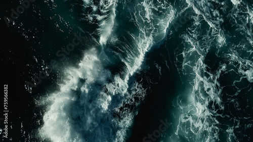 Aerial view of tumultuous sea waves churning in the ocean.