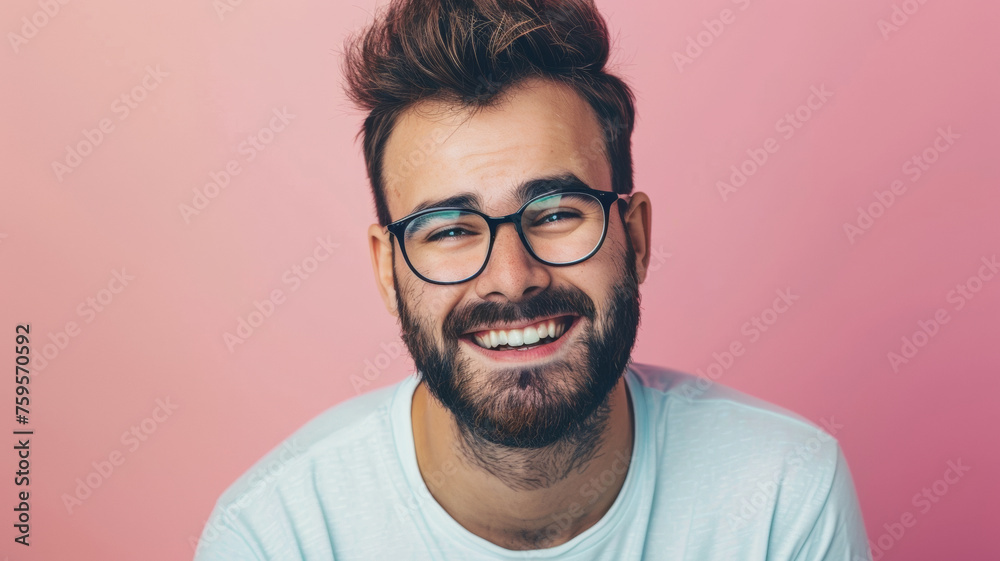 Joyful bearded man smiling with glasses on a pink background. Joyful bearded man smiling with glasses on a pink background.
