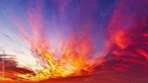 Time-lapse of beautiful natural landscape of fire clouds at sunset photo