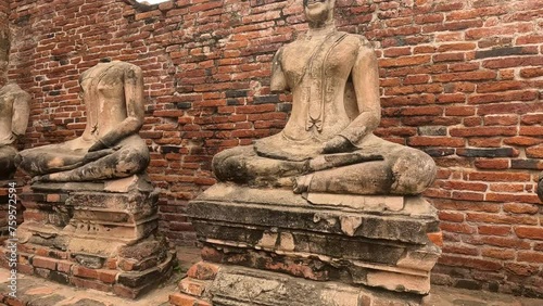 Ancient Buddha Statues in Ruins photo