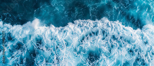 Aerial view to ocean waves. Blue water background. 