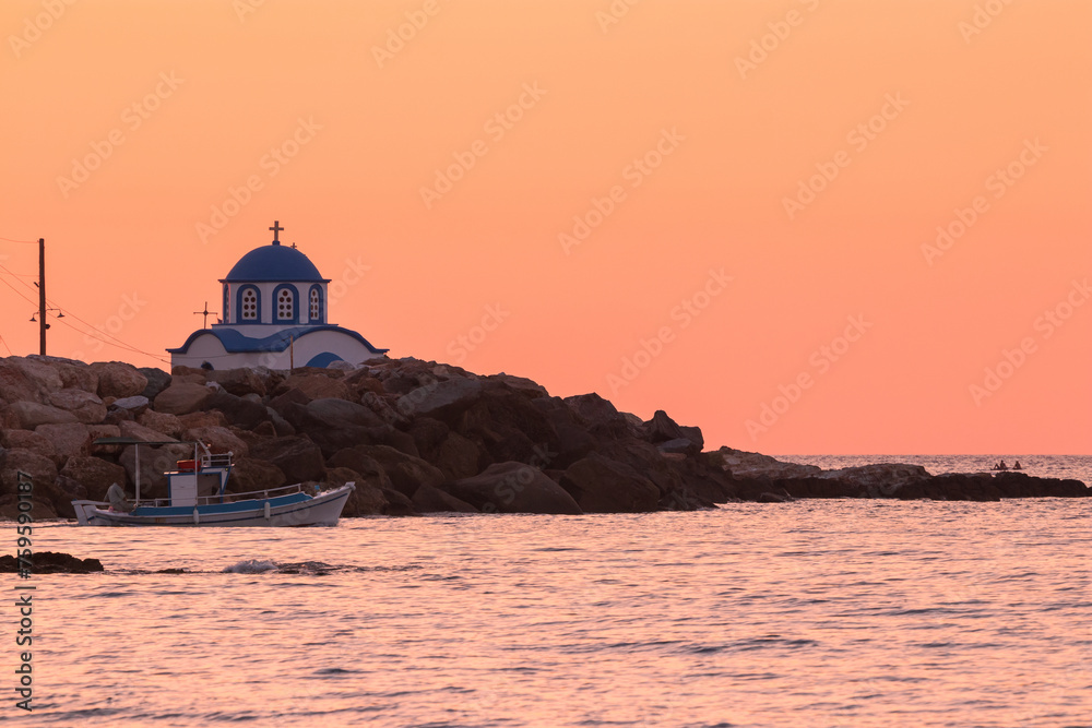 Gialiskari chapel and lonely fisherboat at dawn on the Noth Aegean Island of Ikaria island