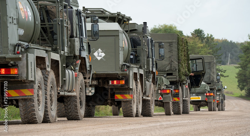 a convoy of British army utility vehicles in action on a military exercise, Wilts UK