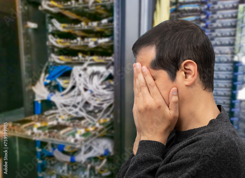 Profile shot of an IT technician having difficulty repairing a computer in a data center of AI.