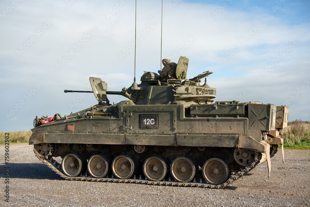 British army Warrior FV510 IFV in action on a military exercise, Wilts UK
