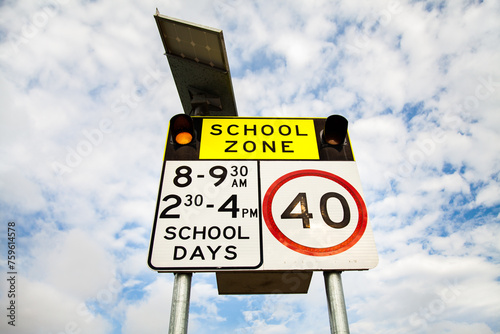 40 School zone sign with lights on photo
