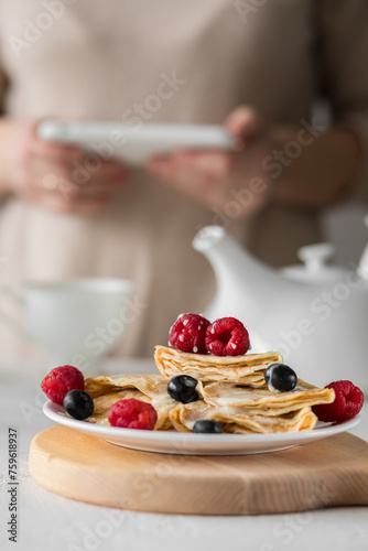 hands making pancakes at breakfast 