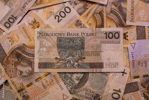 two bundles of money - 200 and 100 PLN