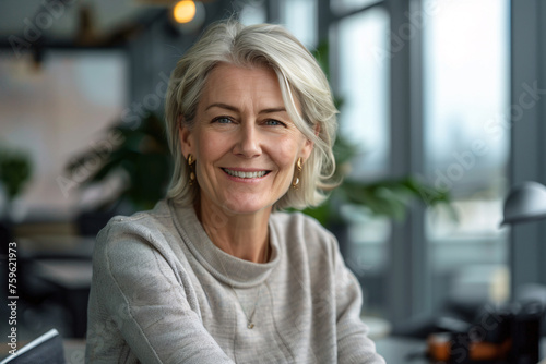 Business portrait of a smiling female senior CEO in her office Free Download Business portrait of a smiling female senior CEO in her office - GFXLoad